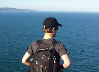 student by the ocean