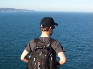 student by the ocean